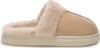 A side view of a single beige slipper with cream-colored faux fur lining.