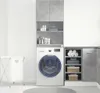 A laundry room with a washing machine, storage shelves, and a laundry basket. Náhled obrázku produktu