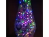 A close-up shot of a glass vase filled with colorful LED string lights. Podgląd zdjęcia produktu