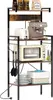 A multi-tiered kitchen baker's rack with appliances and kitchenware. Voir les images du produit