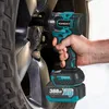 A person is using a cordless impact wrench to tighten a lug nut on a car wheel. Produktbild-Vorschau
