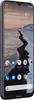 A smartphone is shown from a diagonal angle, displaying its screen and part of its side. Náhled obrázku produktu