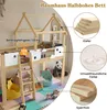 A children's loft bed with a house-like frame, set up in a room with toys and soft flooring. Anteprima dell’immagine prodotto
