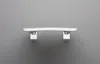 A white handle mounted on a gray wall. Produktbild-Vorschau
