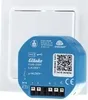 A blue electronic device is placed in front of a white wall plate. Produktbild-Vorschau