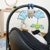 A baby car seat with hanging toys. Produktbild-Vorschau