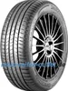 A close-up studio shot of a Bridgestone Turanza T005 tire mounted on a black and silver alloy wheel. Produktbild-Vorschau