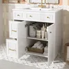 A white bathroom vanity with its doors open, showing storage space with toiletries and towels inside. The vanity is placed on a patterned tiled floor. Anteprima dell’immagine prodotto