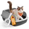 A cat is sitting in a litter box with a scoop and a tag. Produktbild-Vorschau