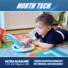A baby is playing with a toy laptop on a colorful playmat. Produktbild-Vorschau