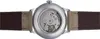 The back of a watch with a visible mechanical movement and leather strap. Voir les images du produit
