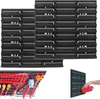 A collection of black pegboard panels and a pegboard with various tools and accessories attached. Anteprima dell’immagine prodotto