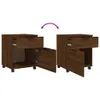Two identical mobile filing cabinets are shown side-by-side against a white background. The cabinet on the left has its drawer pulled out and its door open, revealing the interior. The cabinet on the right has its drawer pulled out. A purple curved arrow g Podgląd zdjęcia produktu