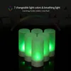 A group of green LED candles are displayed on a black surface, with a colorful light spectrum graphic above them. Produktbild-Vorschau