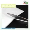 A close-up of scissors cutting a white filter material, with instructions in German. Produktbild-Vorschau