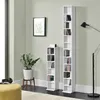 A living room scene with two white CD shelves, one tall and one short, filled with CDs. A potted plant and a floor lamp are also visible. Produktbild-Vorschau