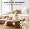 A rain diffuser with a remote control is placed on a wooden table in a bedroom setting. Produktbild-Vorschau
