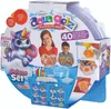 The image shows the packaging of a Simba Aqua Gelz Deluxe Set, featuring a unicorn illustration, children, and the product contents. Voir les images du produit