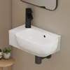 A modern white ceramic wall-mounted sink with a black faucet. Produktbild-Vorschau