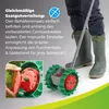 A person using a seed planter in a garden. Produktbild-Vorschau