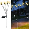 A split image showing solar-powered firefly lights. The left side is a product shot on a white background, and the right side shows the lights in a garden at night. Produktbild-Vorschau