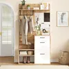 A well-lit hallway furniture set with a mirror, coat rack, and shoe storage. Voir les images du produit