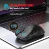 A black gaming mouse is placed on a laptop keyboard. Produktbild-Vorschau
