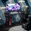 A gaming desk setup with a computer, monitor, keyboard, and chair. Produktbild-Vorschau