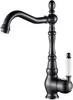 A black kitchen faucet with a white handle, isolated on a white background. Anteprima dell’immagine prodotto