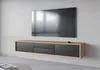 A modern, wall-mounted TV stand with drawers and a television mounted above it. Náhled obrázku produktu