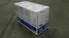 A cardboard box for an HP toner cartridge sits on a concrete floor. Náhled obrázku produktu