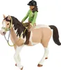 A toy horse and rider figurine. Produktbild-Vorschau