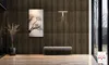 A modern entryway with wood-paneled walls, a bench, and artwork. Náhľad obrázku produktu
