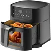 A black air fryer with a roasted chicken inside, shown with its drawer pulled out. Produktbild-Vorschau