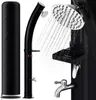 A black outdoor shower with a shower head and faucet, shown with water spraying from the shower head. Náhled obrázku produktu