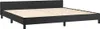 A black bed frame with a wooden slat base, shown from a diagonal angle against a white background. Náhled obrázku produktu
