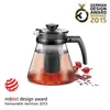 A glass teapot filled with red liquid, accompanied by awards and decorative elements. Anteprima dell’immagine prodotto