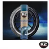 A can of K2 Bold tyre care product is shown in front of a car tire. The background is dark and moody with blue lighting effects. Produktbild-Vorschau