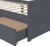A close-up view of a dark gray wooden bed frame with an open drawer. Náhľad obrázku produktu