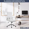 A white ergonomic office chair is placed in a modern home office setting with a desk, computer, and lamp. Produktbild-Vorschau