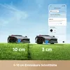 Two robotic lawnmowers are shown on a lawn, with a smartphone app interface in the background demonstrating mowing height settings. Produktbild-Vorschau