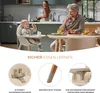 A family is having breakfast in a modern kitchen, with a baby in a high chair. Produktbild-Vorschau