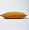 A side view of a mustard yellow pillow on a white background. Produktbild-Vorschau