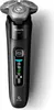 A black electric shaver with silver shaving heads is shown against a white background. Náhled obrázku produktu