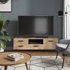 A modern living room scene featuring a TV stand with a television, a chair, a coffee table, and a plant. Podgląd zdjęcia produktu