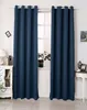 Two dark blue curtains are hung on a window, with a white dresser and a small table visible on either side. Produktbild-Vorschau