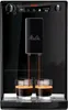 A black Melitta Caffeo Solo E 950-222 coffee machine is shown brewing two espressos into clear glasses. Produktbild-Vorschau