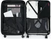An open suitcase with clothes and items packed inside. Náhled obrázku produktu