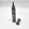 A black Philips nose trimmer and an attachment are displayed on a white background. Podgląd zdjęcia produktu