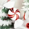 A close-up of a Christmas tree decoration shaped like a candy cane candy. Náhľad obrázku produktu